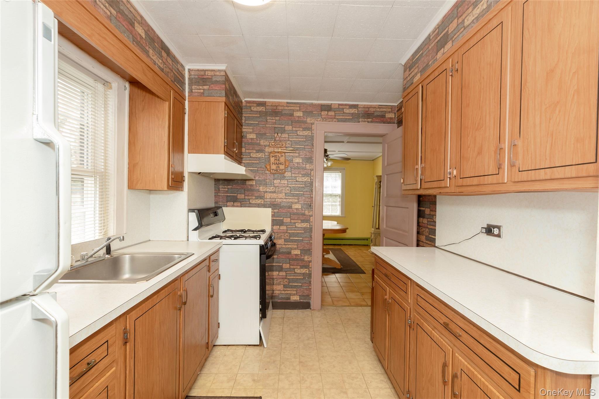531 1/2 Willett Avenue Port Chester, NY 10573 - Photo 14 of 31 a kitchen with a sink stove and cabinets