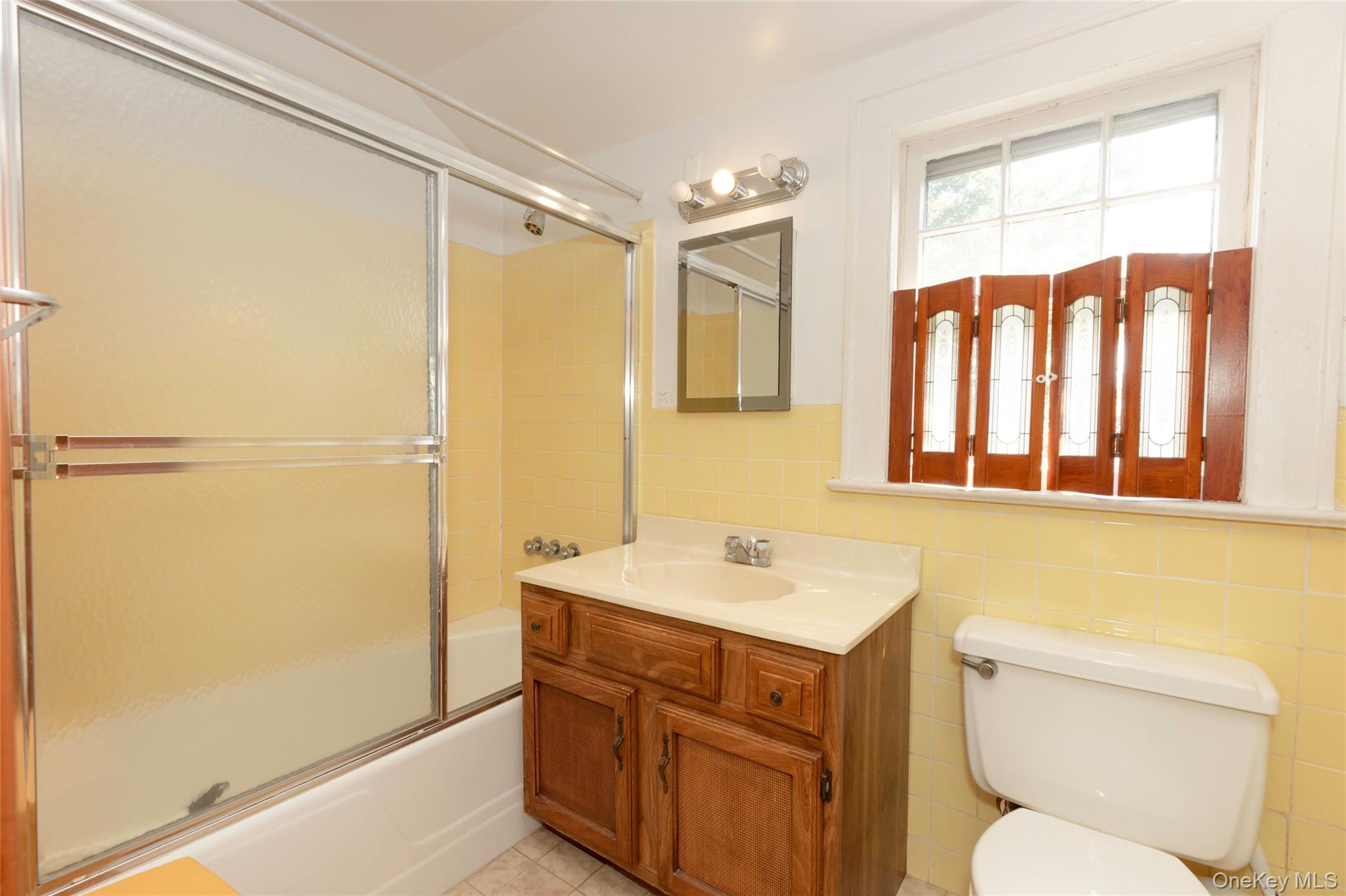 531 1/2 Willett Avenue Port Chester, NY 10573 - Photo 15 of 31 a bathroom with a sink a toilet and shower
