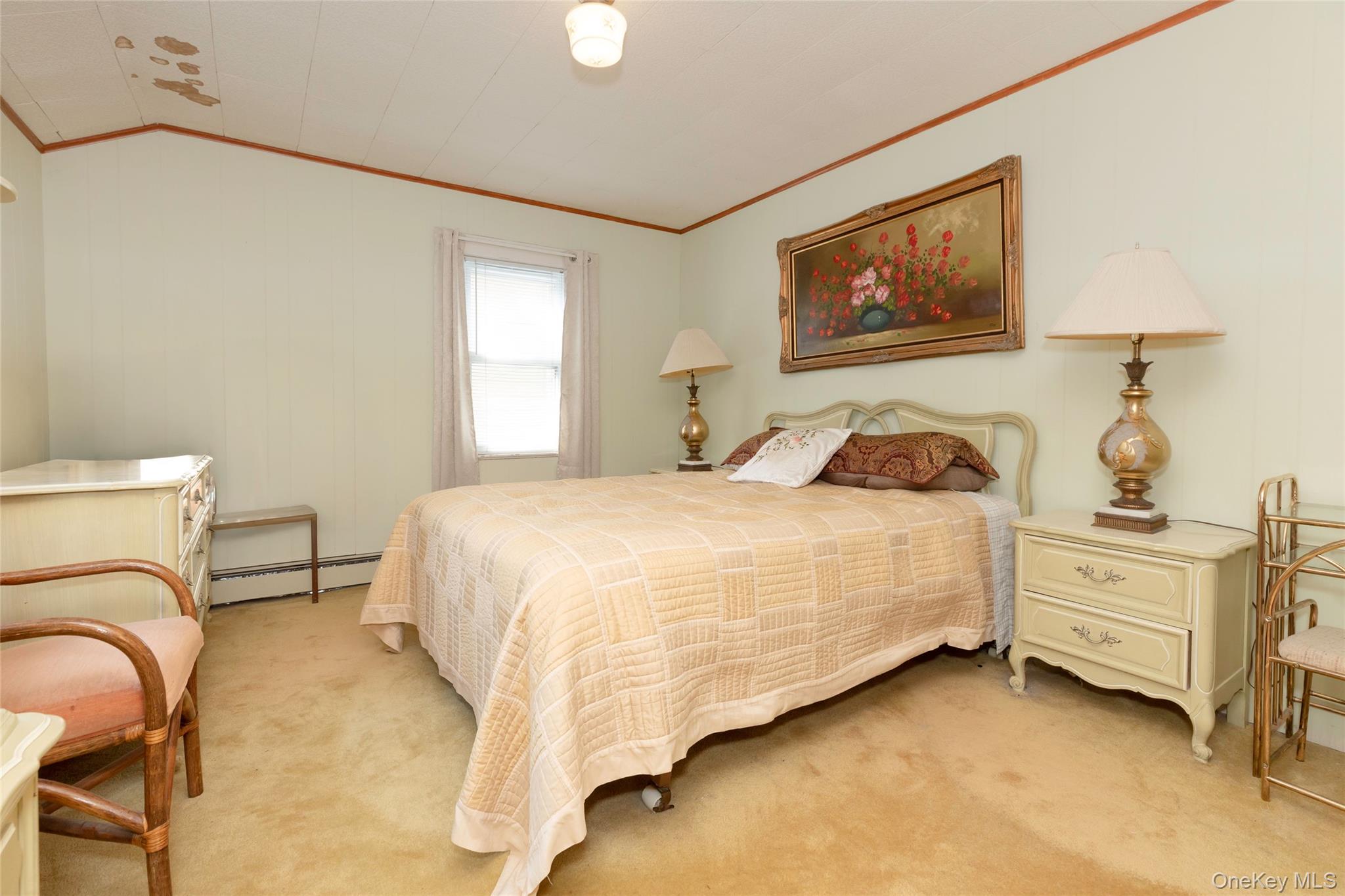 531 1/2 Willett Avenue Port Chester, NY 10573 - Photo 16 of 31 a bedroom with a bed and cabinet