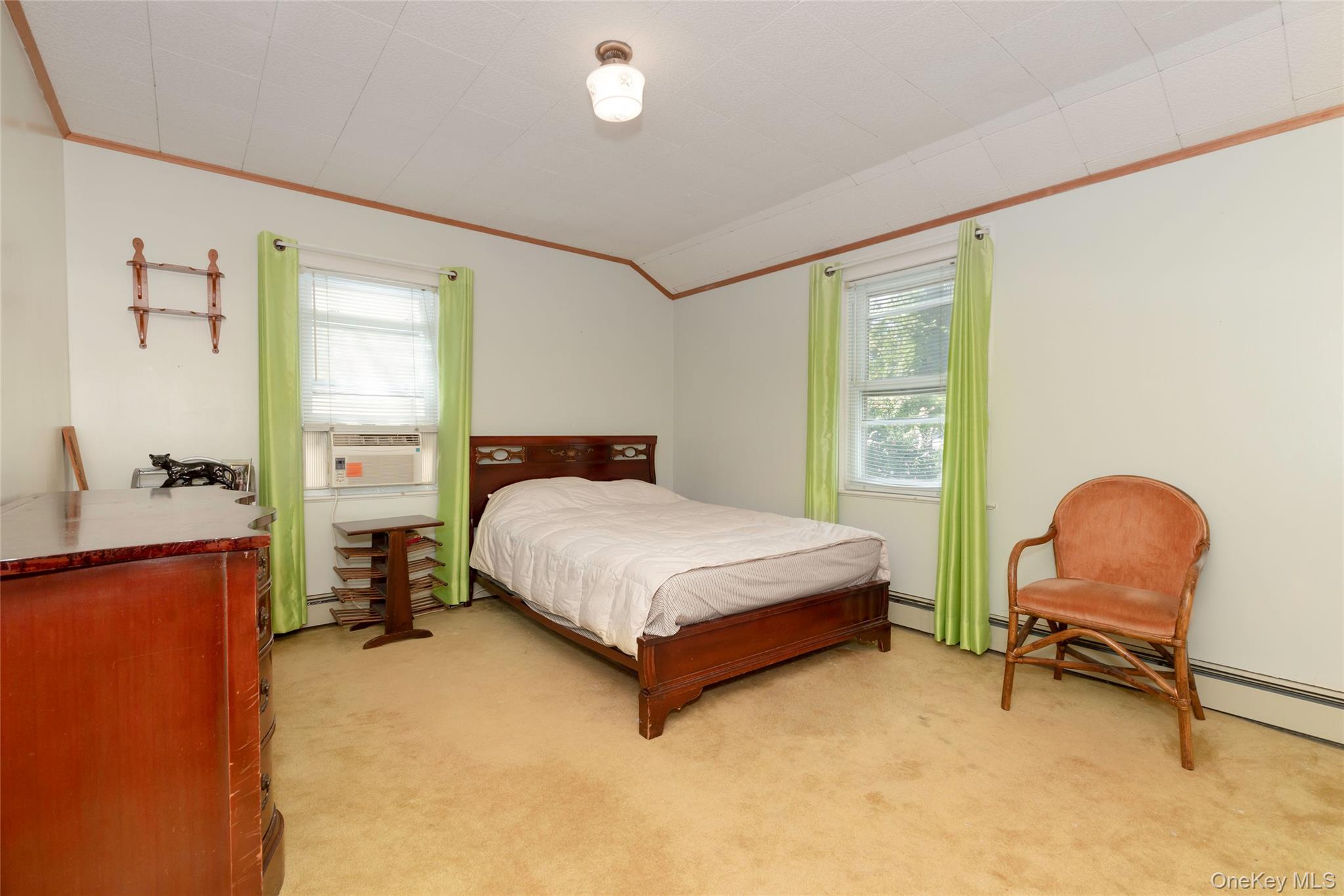 531 1/2 Willett Avenue Port Chester, NY 10573 - Photo 18 of 31 a bedroom with a bed chair and a large window