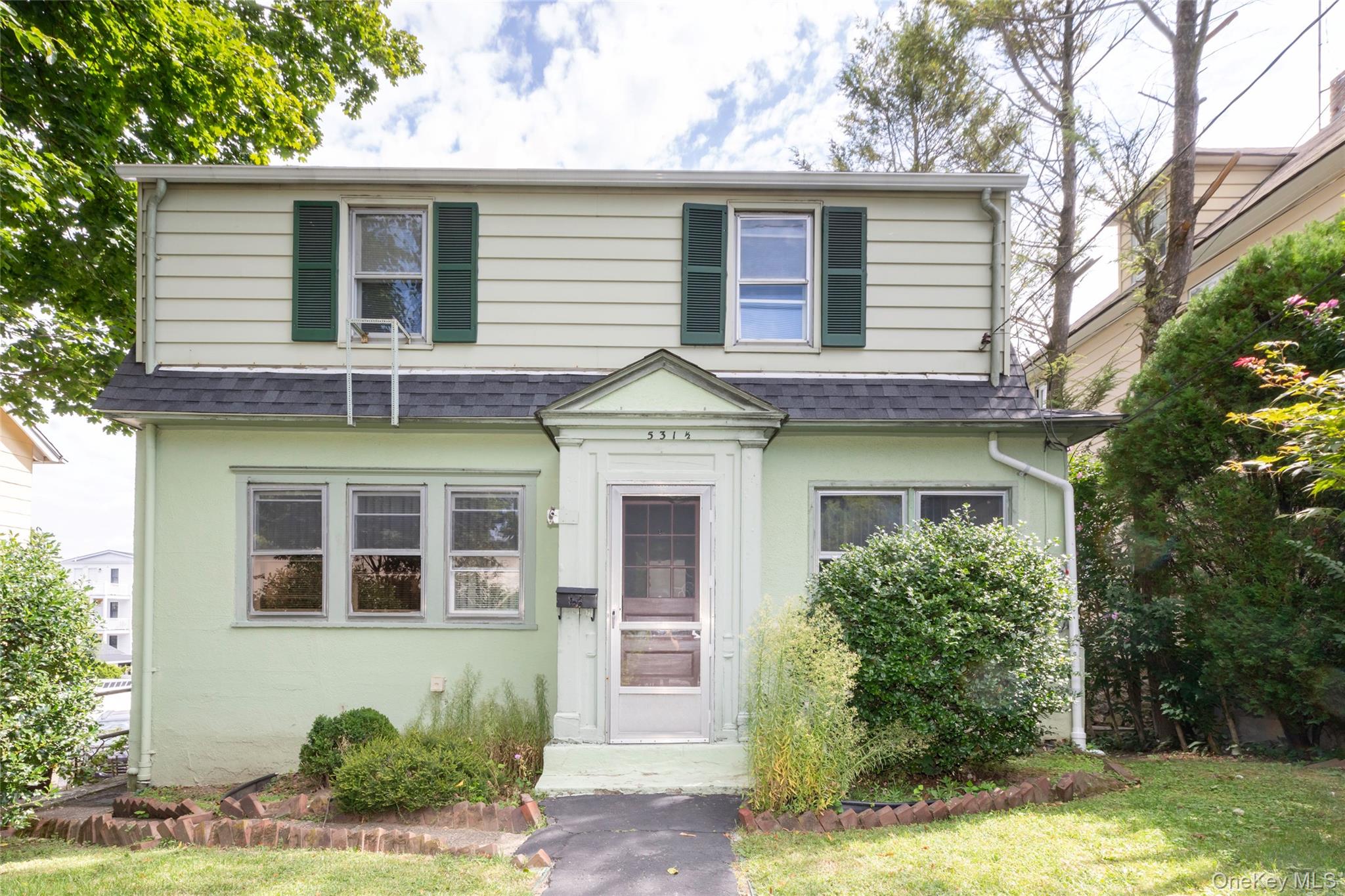 531 1/2 Willett Avenue Port Chester, NY 10573 - Photo 2 of 31 a front view of a house with garden