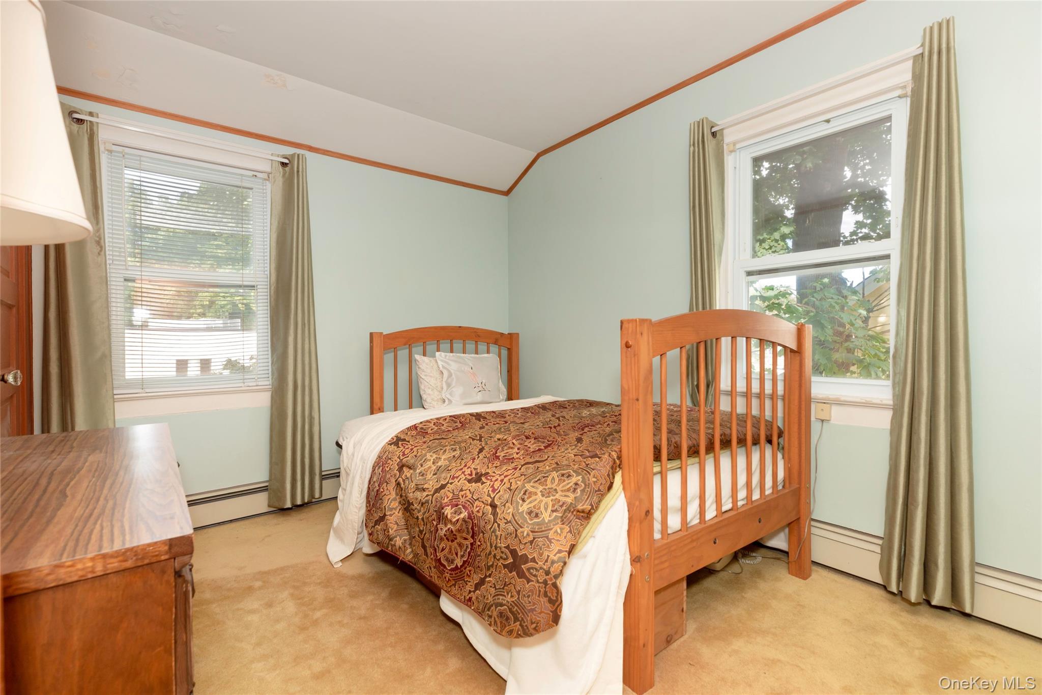 531 1/2 Willett Avenue Port Chester, NY 10573 - Photo 21 of 31 a bedroom with two beds and a window