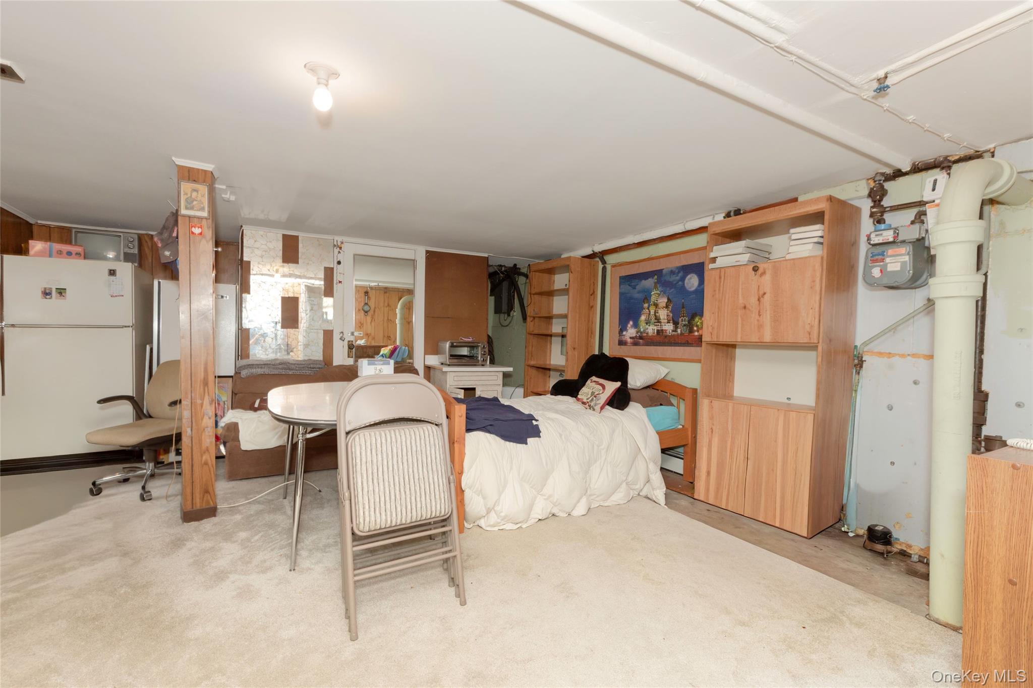 531 1/2 Willett Avenue Port Chester, NY 10573 - Photo 22 of 31 a living room with furniture a window and gym equipment