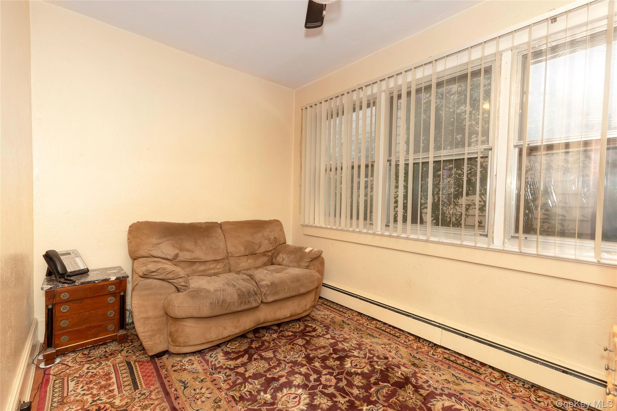 531 1/2 Willett Avenue Port Chester, NY 10573 - Photo 26 of 31 a living room with furniture and a window
