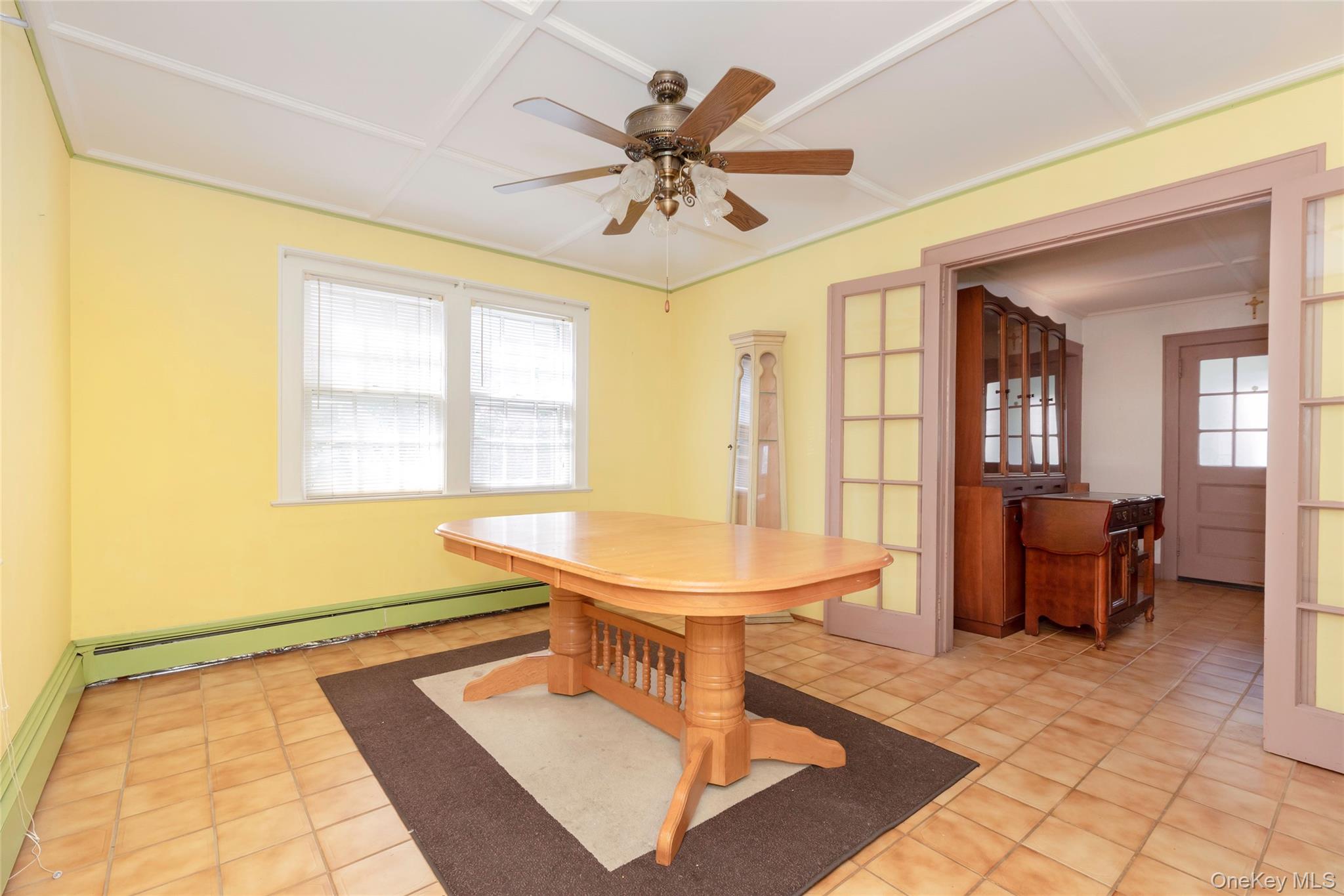 531 1/2 Willett Avenue Port Chester, NY 10573 - Photo 9 of 31 a living room with table chairs and a large window