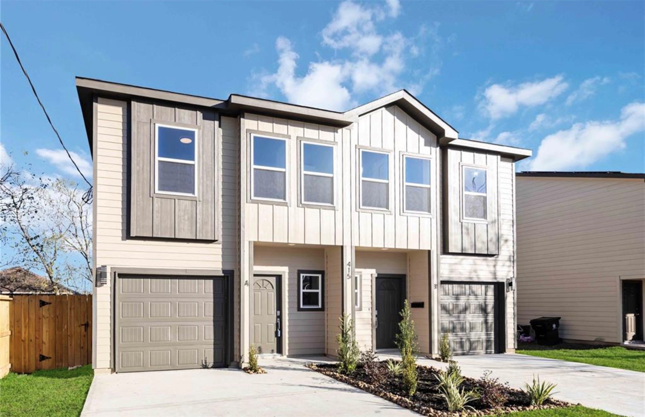 415 Gans Street, Unit AB Houston, TX 77029 - Photo 2 of 24 a front view of a house with a yard