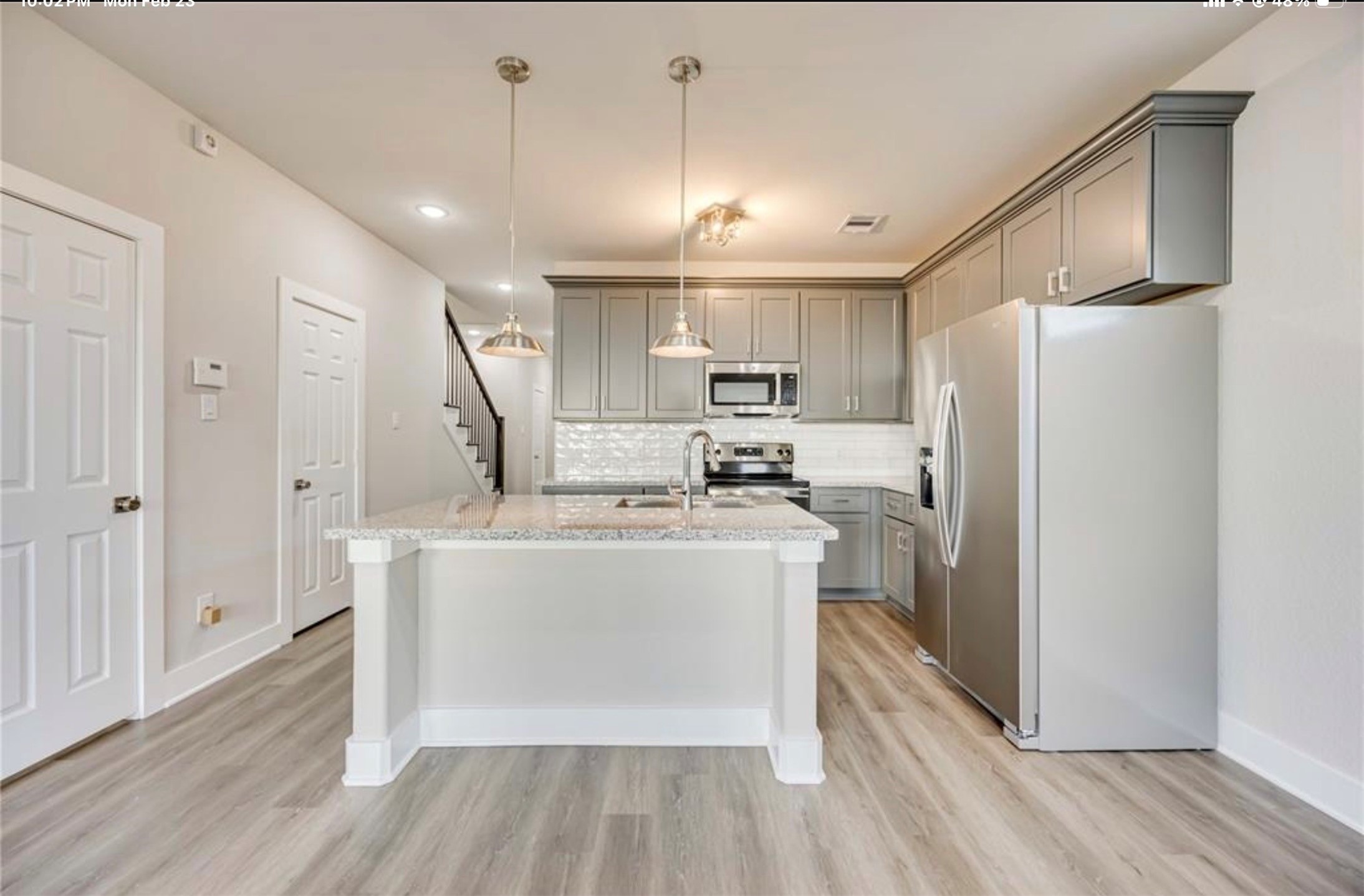 415 Gans Street, Unit AB Houston, TX 77029 - Photo 9 of 24 a view of kitchen with stainless steel appliances refrigerator stove microwave and cabinets