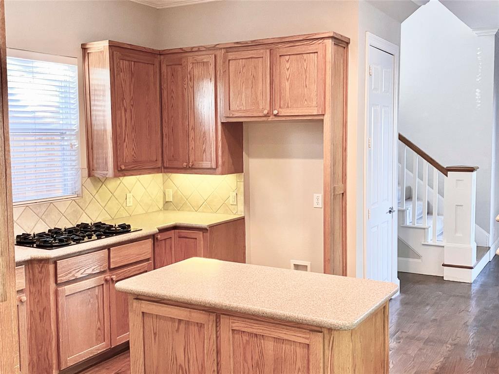 2605 Tulip Drive Richardson, TX 75082 - Photo 15 of 30 a kitchen with stainless steel appliances a stove a sink and cabinets