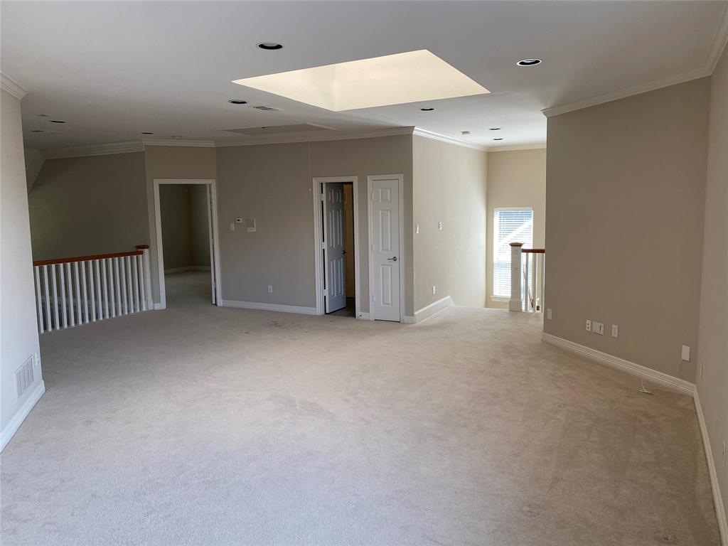 2605 Tulip Drive Richardson, TX 75082 - Photo 16 of 30 an empty room with a ceiling fan