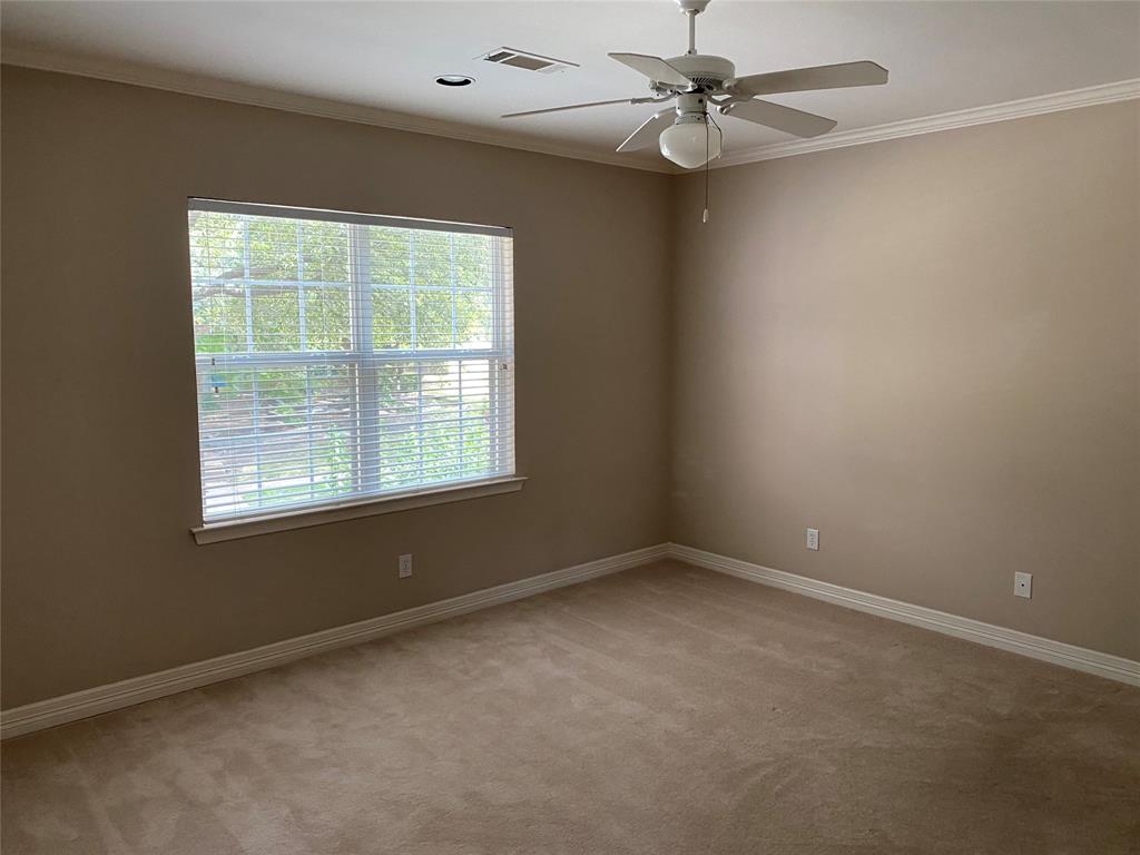 2605 Tulip Drive Richardson, TX 75082 - Photo 27 of 30 an empty room with a window and a fan