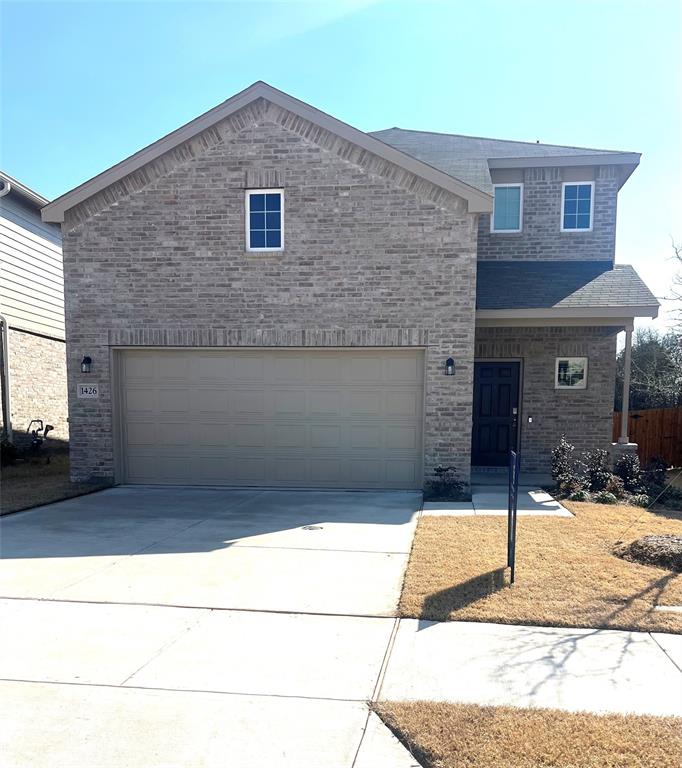 a brick house with a yard
