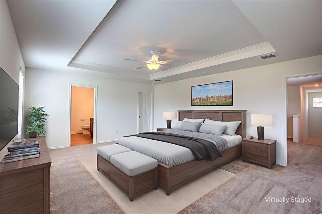 1426 Tramore Way Princeton, TX 75407 - Photo 11 of 20 a spacious bedroom with a bed and a chandelier