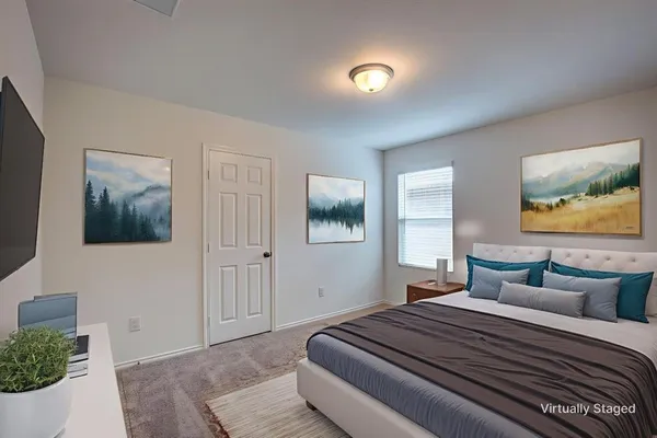 a bedroom with bed and window