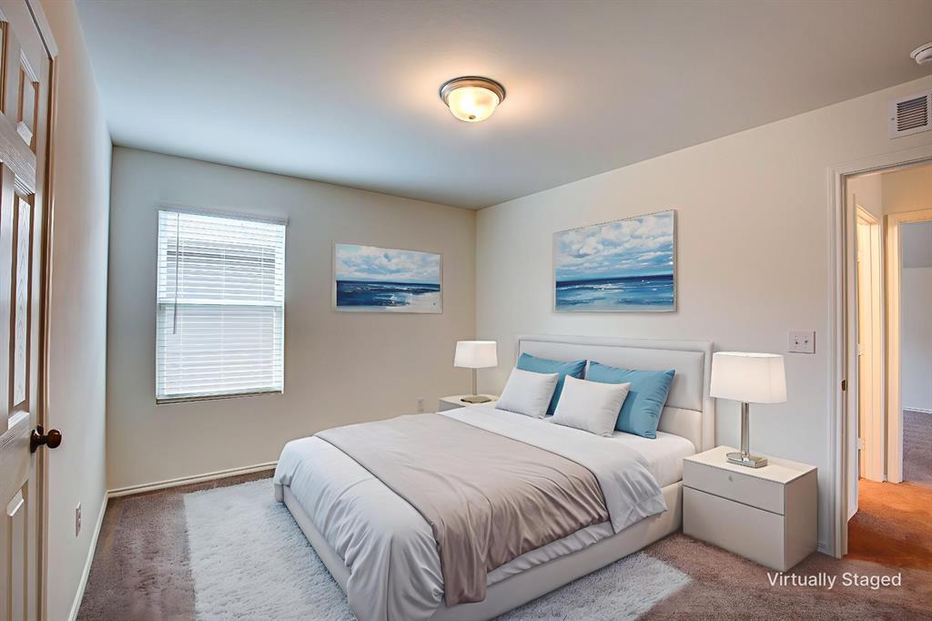 1426 Tramore Way Princeton, TX 75407 - Photo 17 of 20 a bedroom with a bed and a lamp