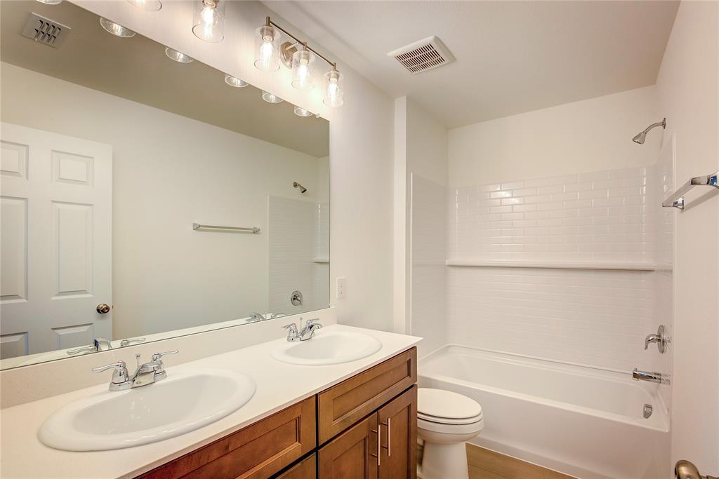 1426 Tramore Way Princeton, TX 75407 - Photo 18 of 20 a bathroom with a sink toilet and shower