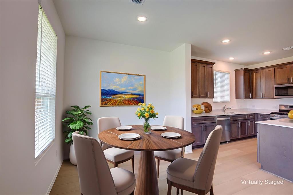 1426 Tramore Way Princeton, TX 75407 - Photo 4 of 20 a kitchen with stainless steel appliances granite countertop a dining table chairs and window