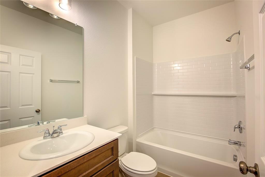 1426 Tramore Way Princeton, TX 75407 - Photo 7 of 20 a bathroom with a sink toilet and shower