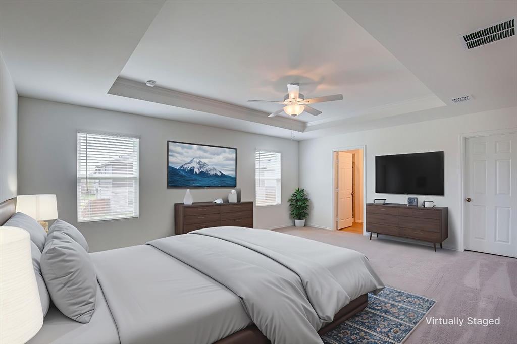 1426 Tramore Way Princeton, TX 75407 - Photo 10 of 20 a bedroom with a bed and a flat screen tv