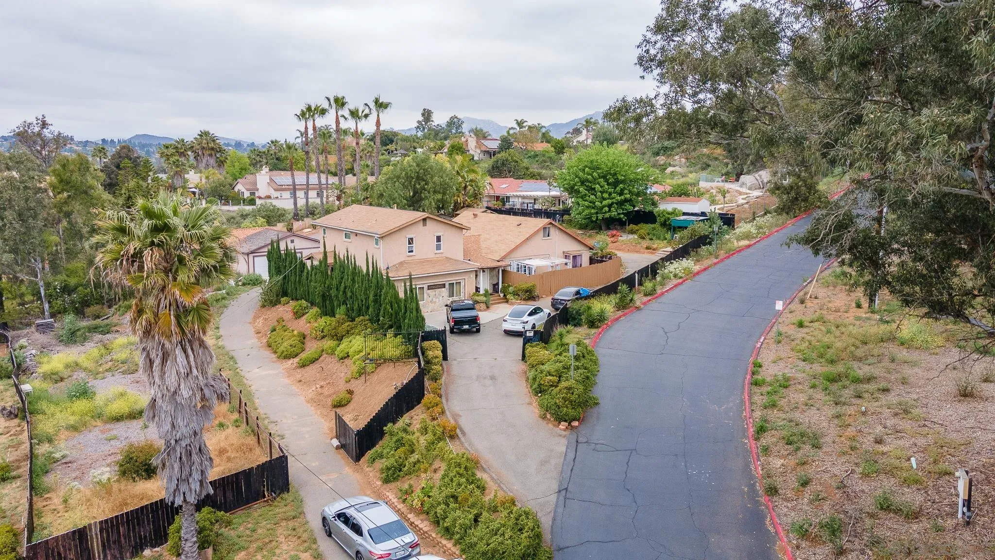an aerial view of a house with yard swimming pool and outdoor seating