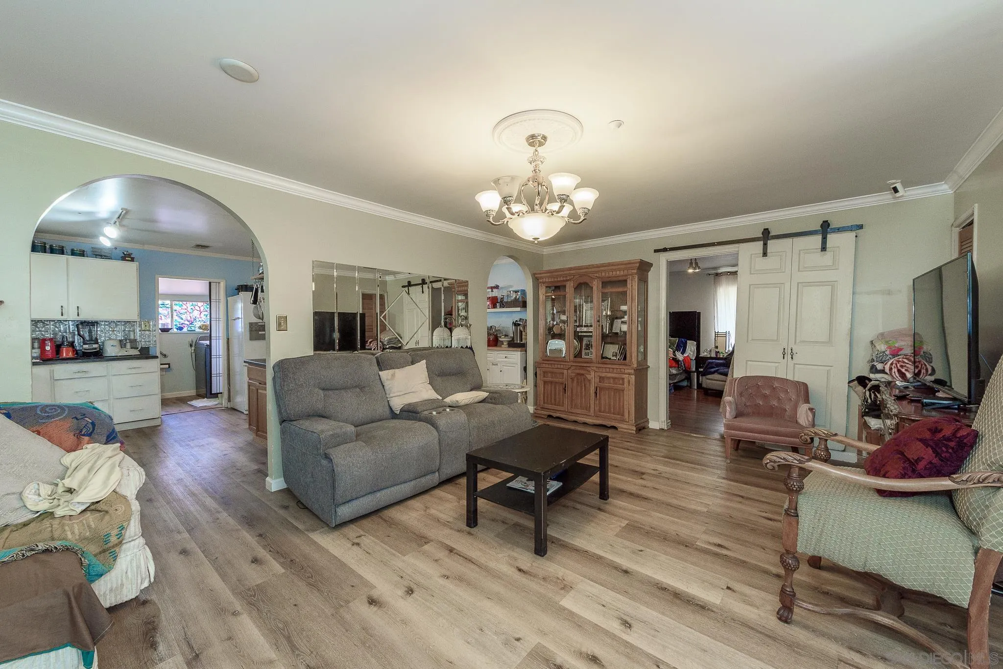 16021 Pomerado Road Poway, CA 92064 - Photo 3 of 15 a living room with furniture and a chandelier