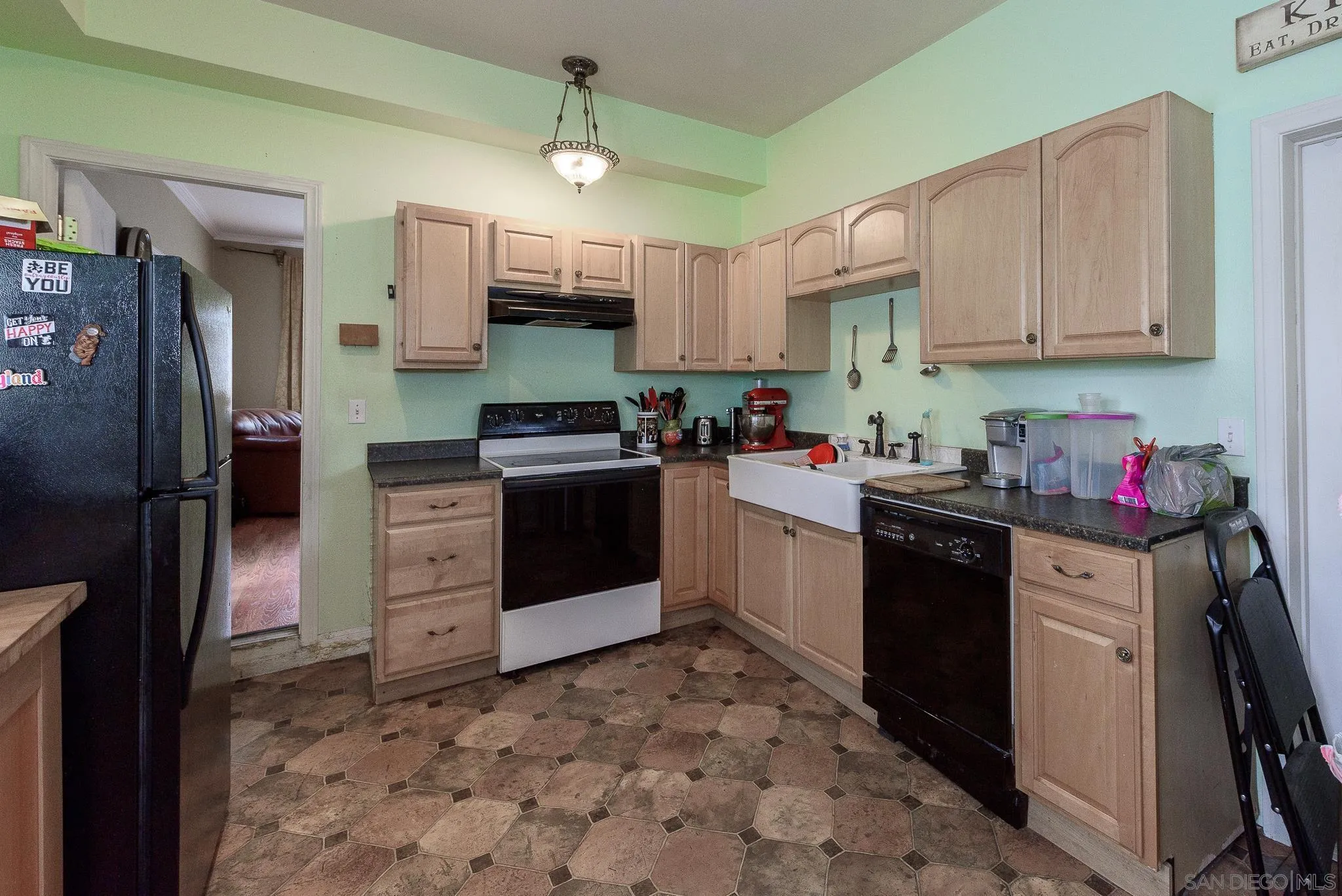 16021 Pomerado Road Poway, CA 92064 - Photo 6 of 15 a kitchen with stainless steel appliances granite countertop a sink stove refrigerator and cabinets