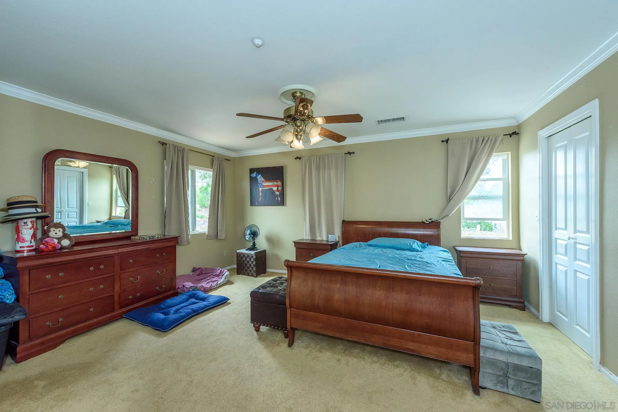16021 Pomerado Road Poway, CA 92064 - Photo 8 of 15 a bedroom with a bed and a mirror on dresser