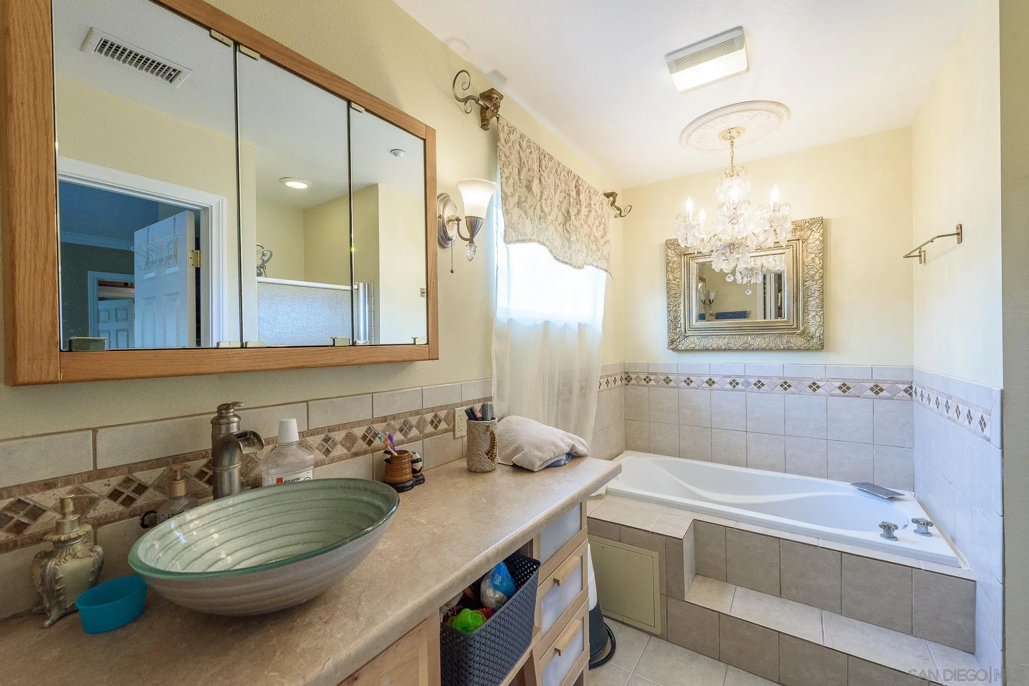 16021 Pomerado Road Poway, CA 92064 - Photo 9 of 15 a bathroom with a sink a toilet and shower
