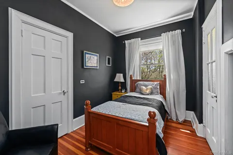 a bed room with a bed and a window