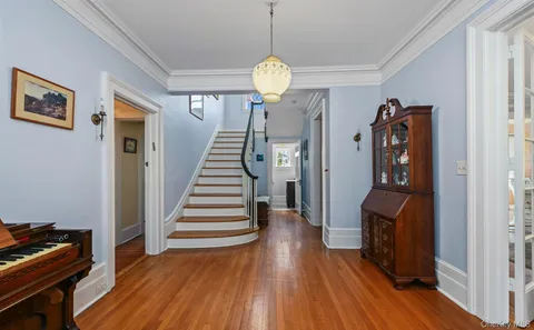 a view of entryway with wooden floor