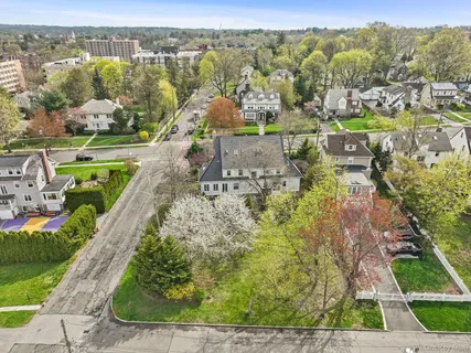 an aerial view of residential houses with outdoor space