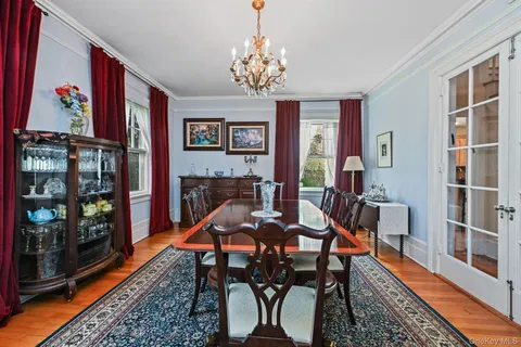 a view of a dining room with furniture wooden floor and a rug
