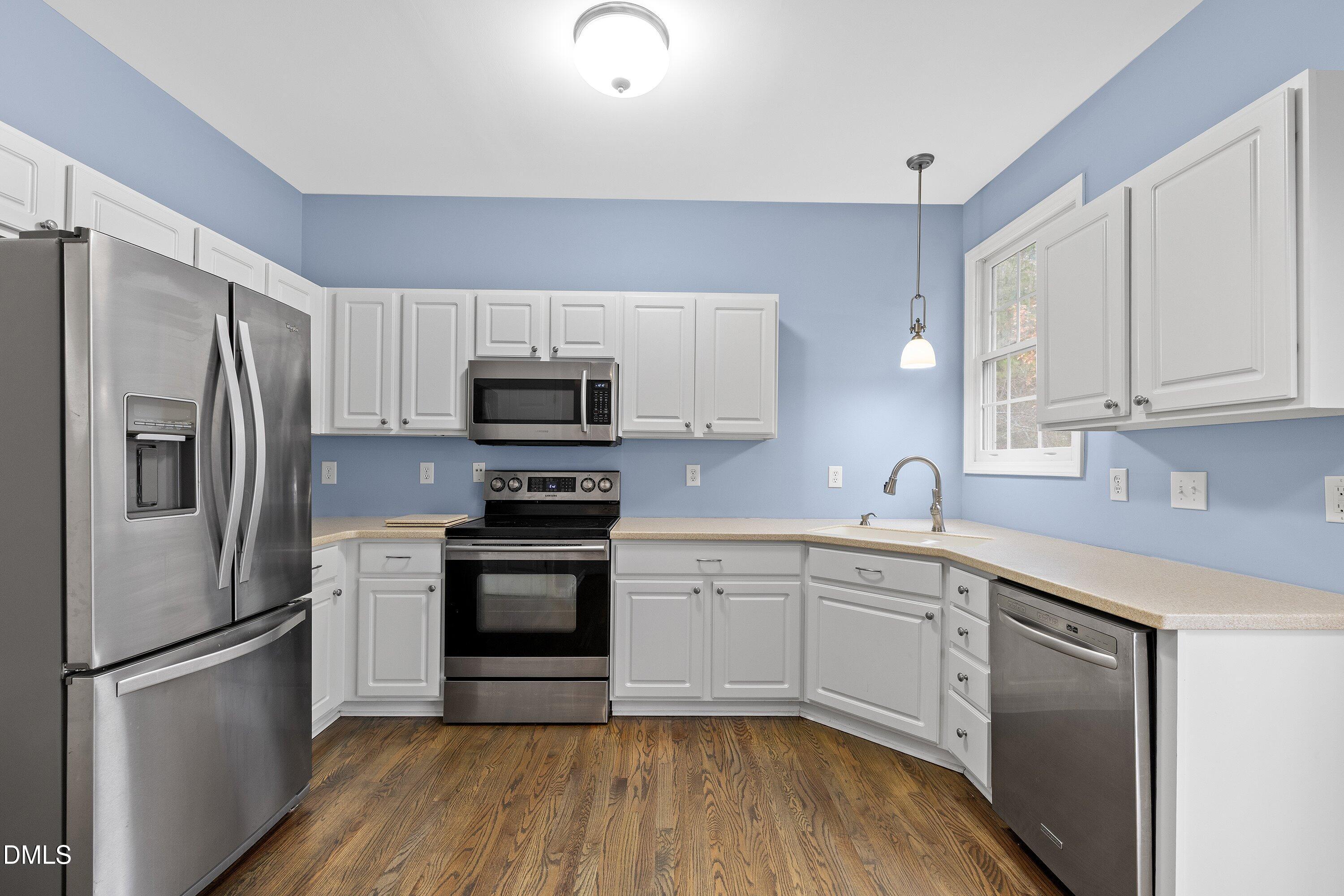 102 College Avenue Durham, NC 27713 - Photo 10 of 39 a kitchen with a sink stainless steel appliances and cabinets