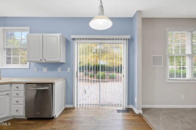 a kitchen with a sink stainless steel appliances and cabinets