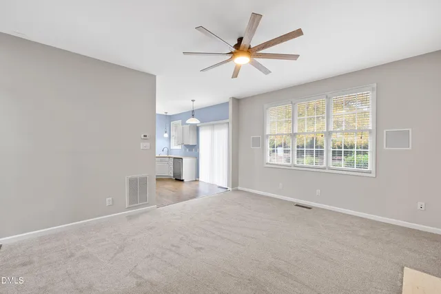 a view of a kitchen with a sink and cabinet
