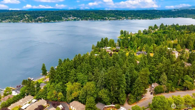 a view of a lake with a field