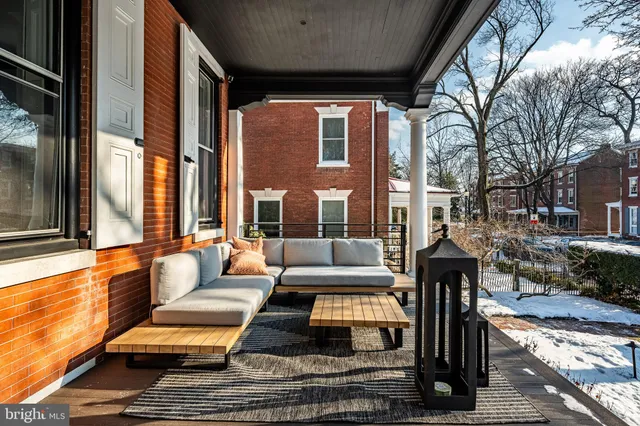 a outdoor space with patio the couches and a dining table with chairs