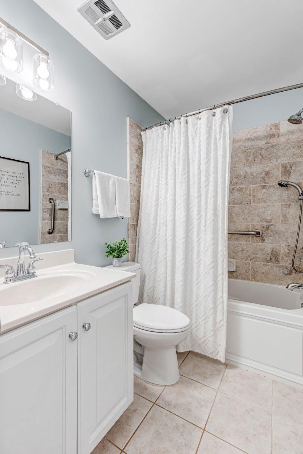 8619 Nanlee Drive Springfield, VA 22152 - Photo 23 of 73 a bathroom with a sink toilet and shower