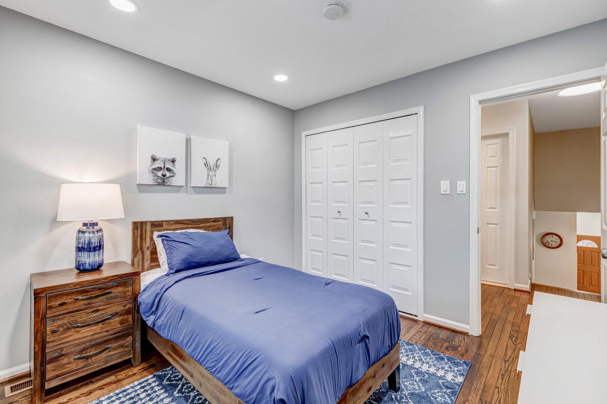 8619 Nanlee Drive Springfield, VA 22152 - Photo 25 of 73 a bedroom with a bed and wooden floor