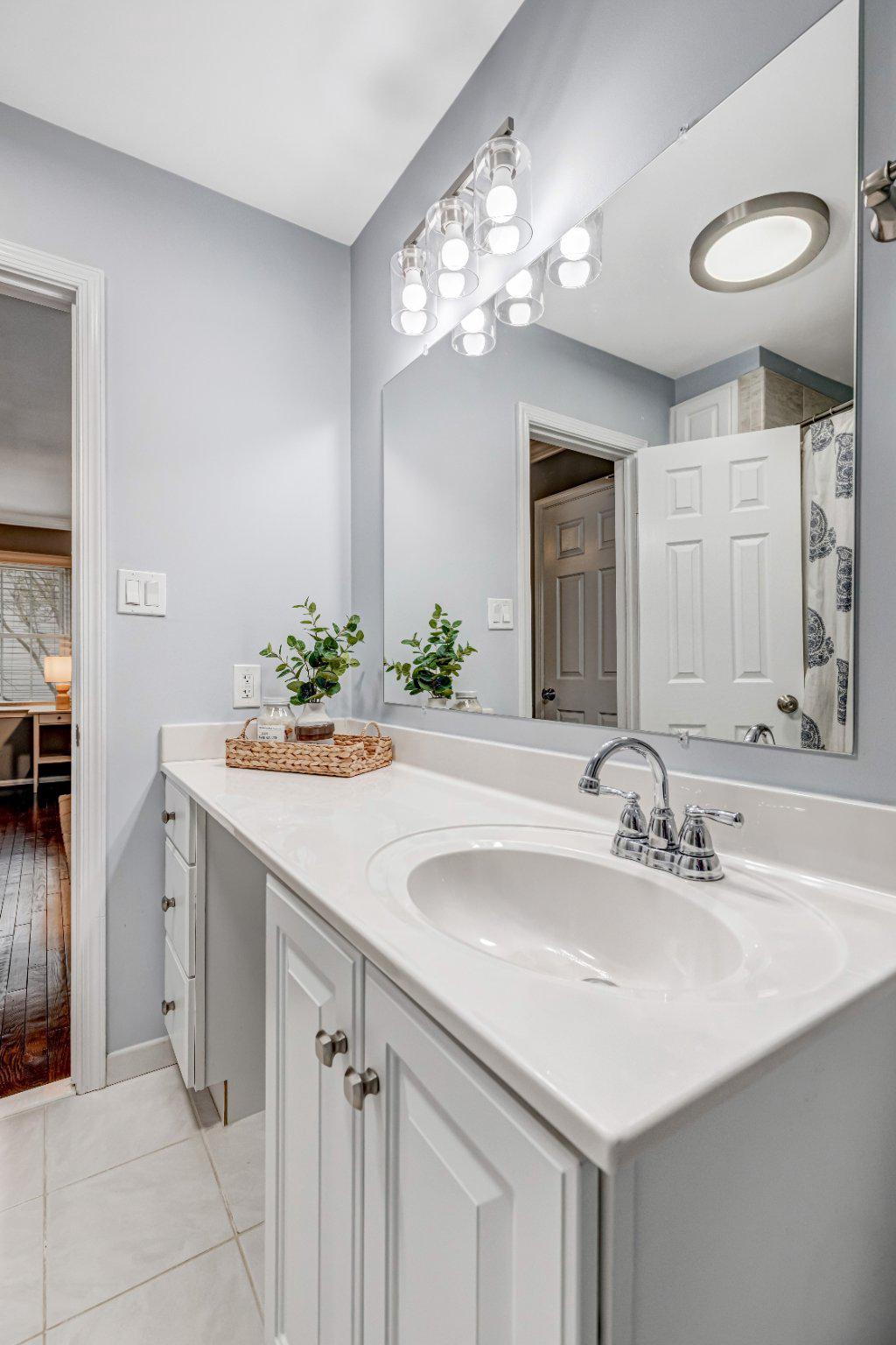 8619 Nanlee Drive Springfield, VA 22152 - Photo 33 of 73 a bathroom with a sink and a mirror