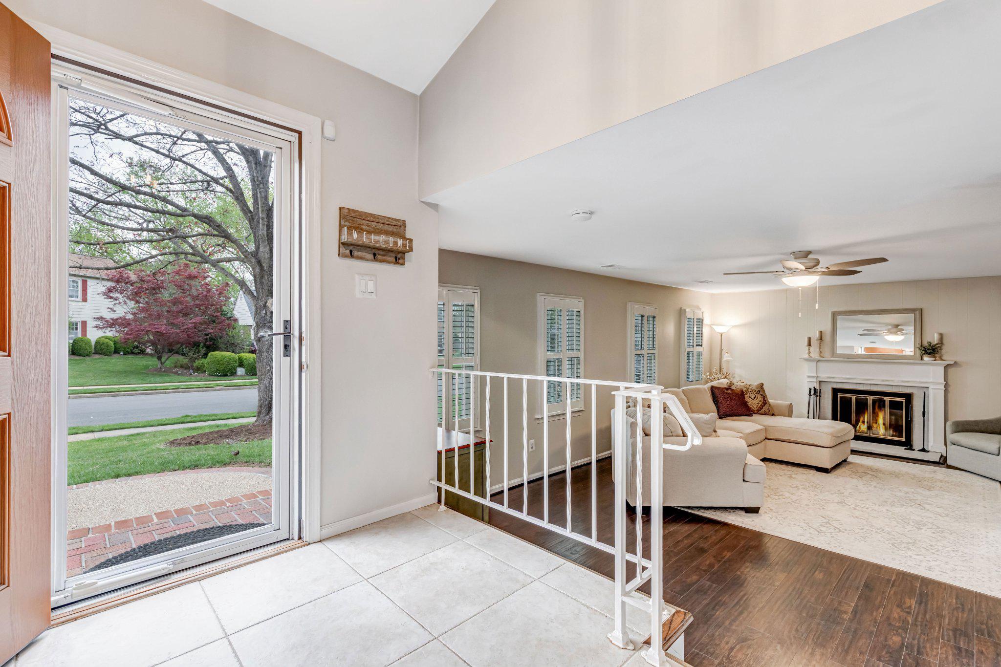 8619 Nanlee Drive Springfield, VA 22152 - Photo 34 of 73 a living room with furniture and a floor to ceiling window