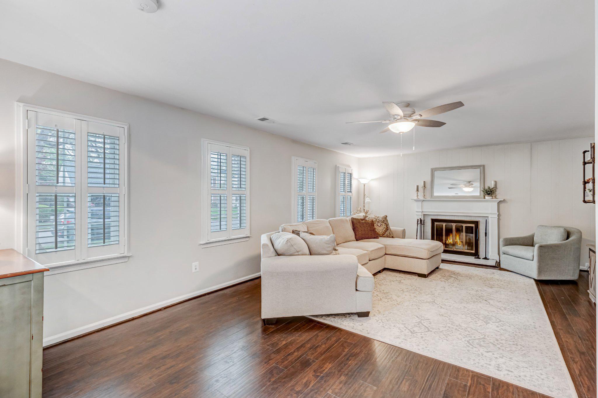 8619 Nanlee Drive Springfield, VA 22152 - Photo 35 of 73 a living room with furniture and fireplace