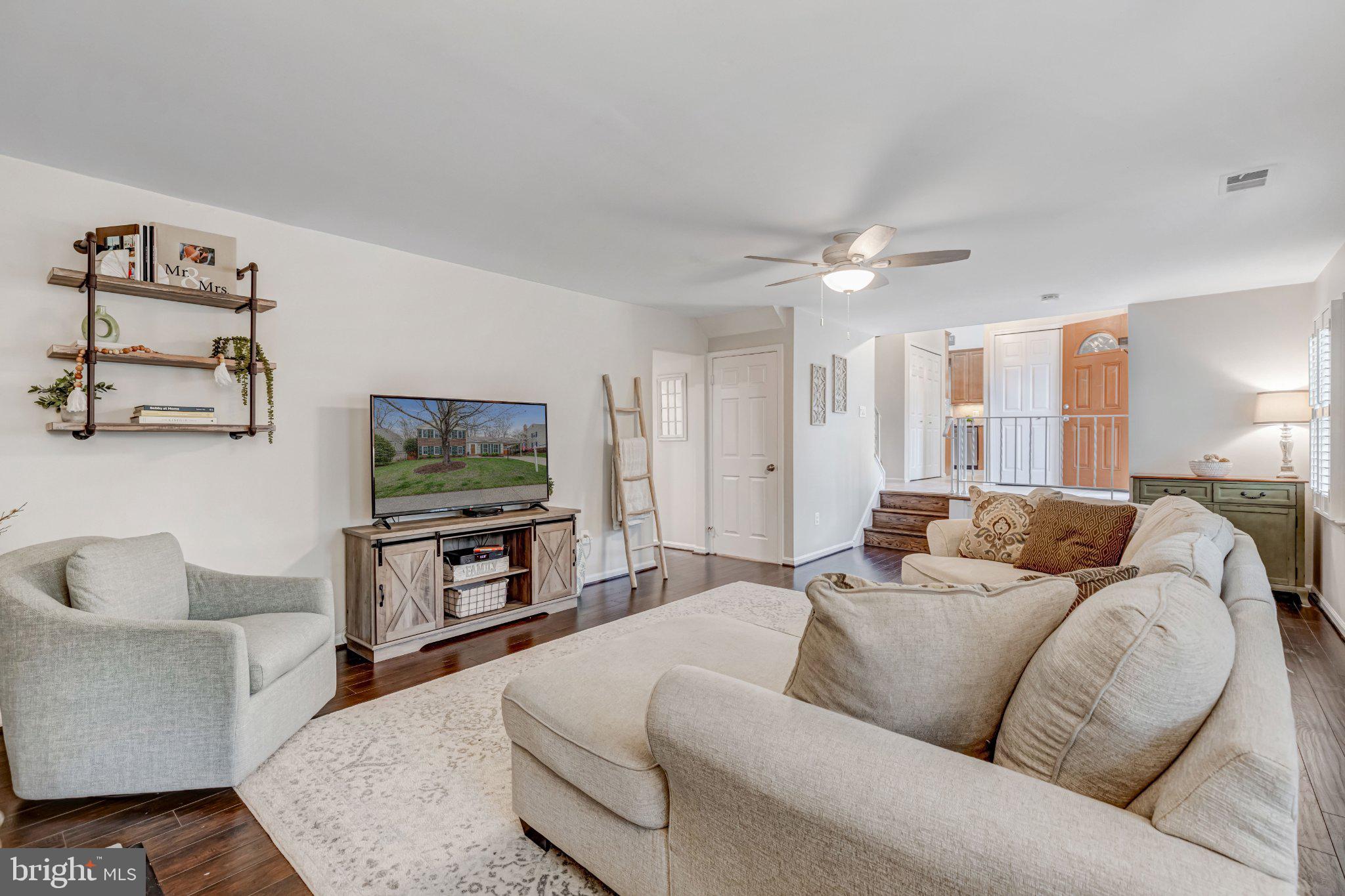 8619 Nanlee Drive Springfield, VA 22152 - Photo 39 of 73 a living room with furniture and a flat screen tv