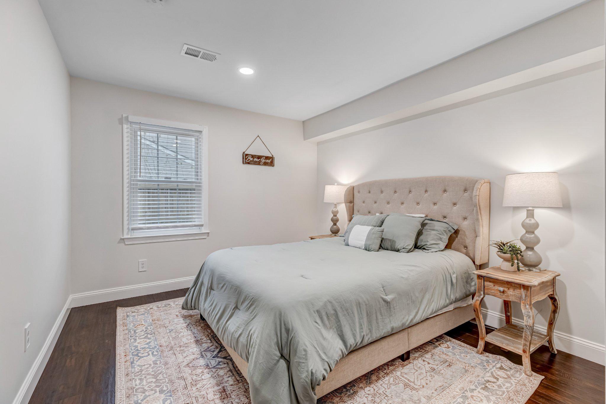 8619 Nanlee Drive Springfield, VA 22152 - Photo 40 of 73 a bedroom with a bed and wooden floor