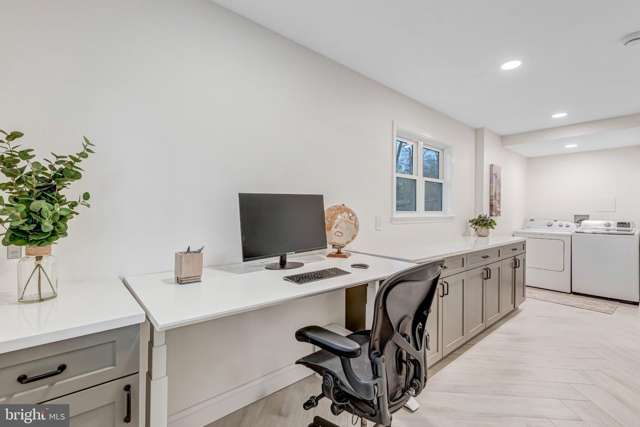 8619 Nanlee Drive Springfield, VA 22152 - Photo 47 of 73 a view of a workspace with furniture and a potted plant