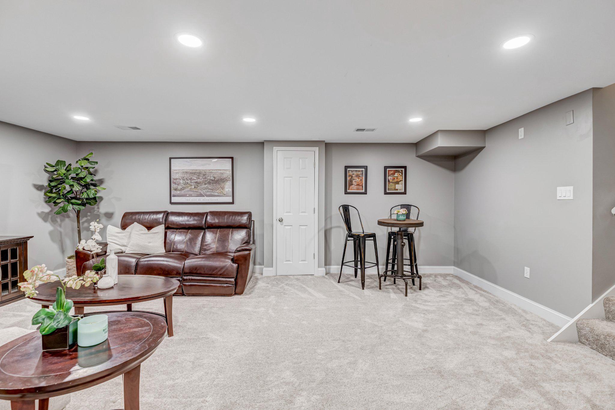 8619 Nanlee Drive Springfield, VA 22152 - Photo 50 of 73 a living room with furniture and a table