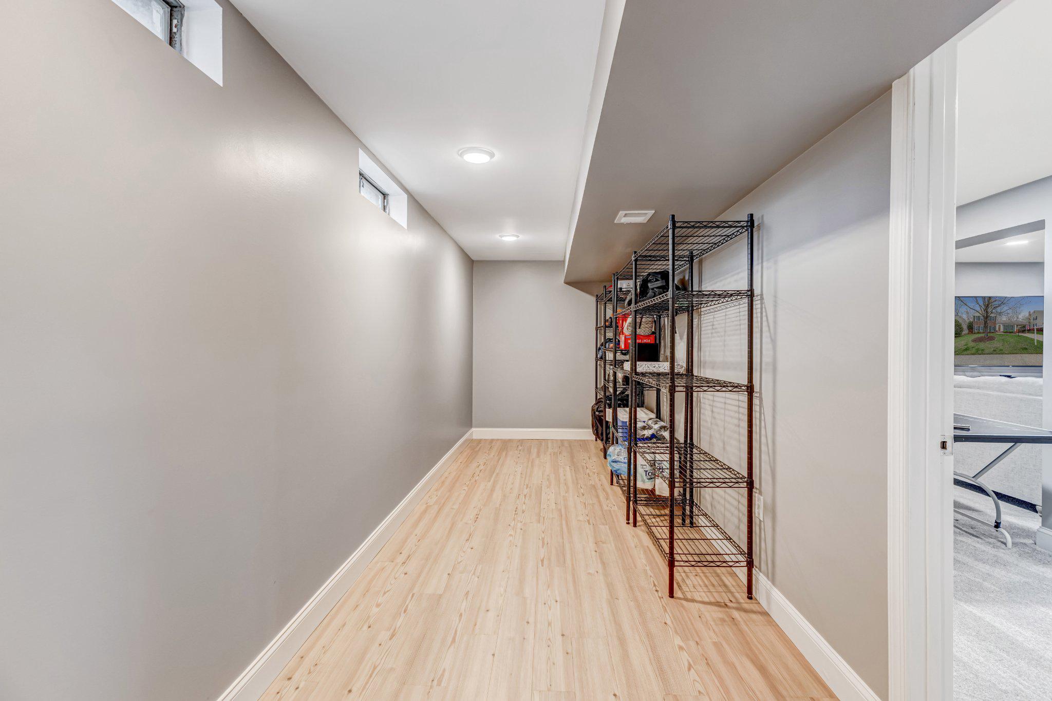 8619 Nanlee Drive Springfield, VA 22152 - Photo 53 of 73 a view of hallway with wooden floor