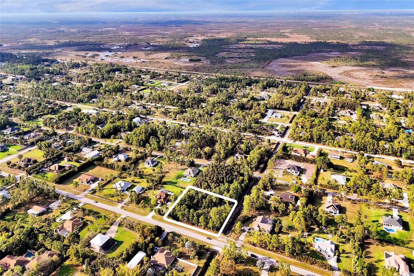 17277 Hamlin Boulevard Loxahatchee, FL 33470 - Photo 16 of 16 an aerial view of residential houses with outdoor space