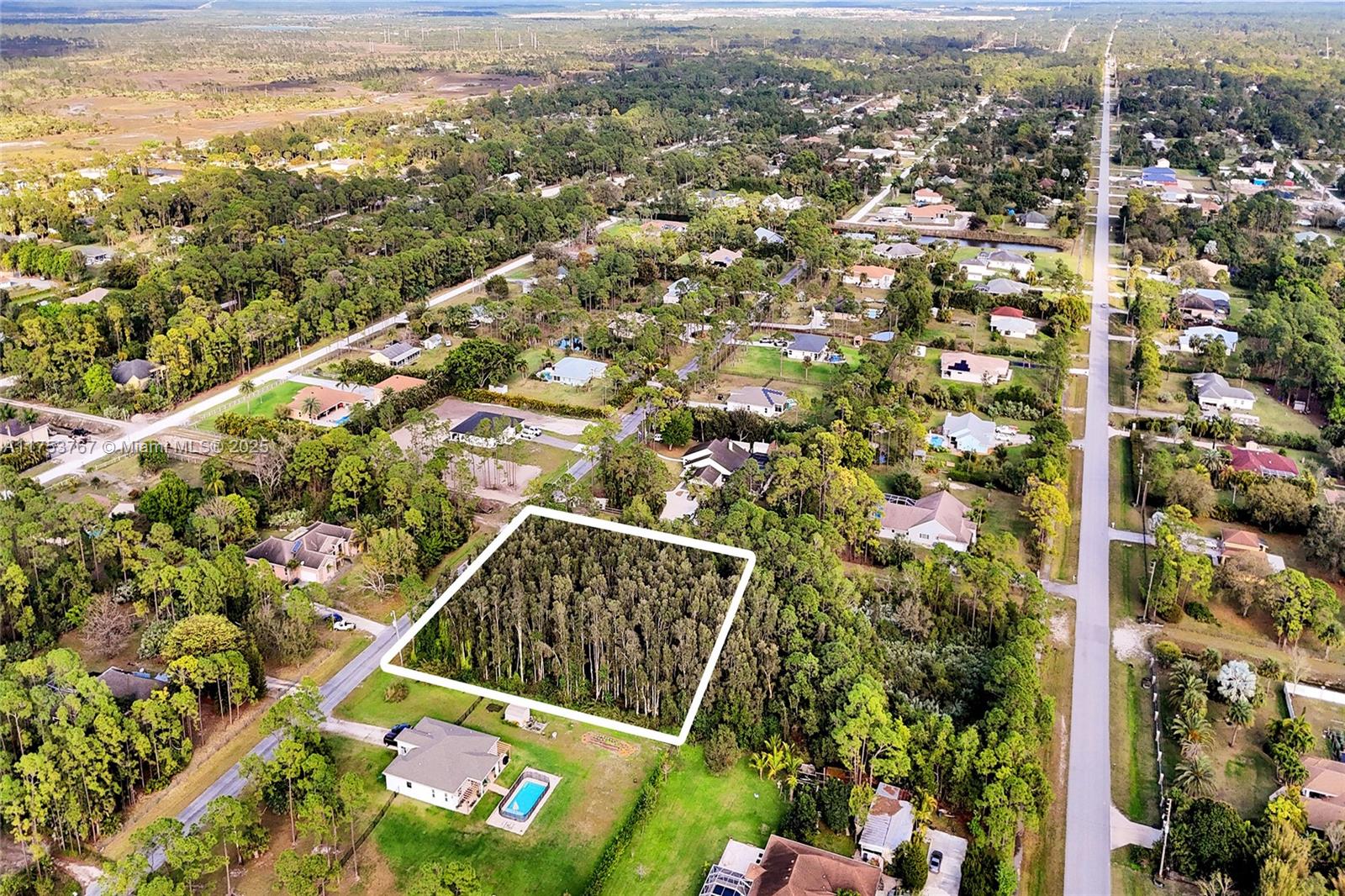 17277 Hamlin Boulevard Loxahatchee, FL 33470 - Photo 6 of 16 an aerial view of multiple house