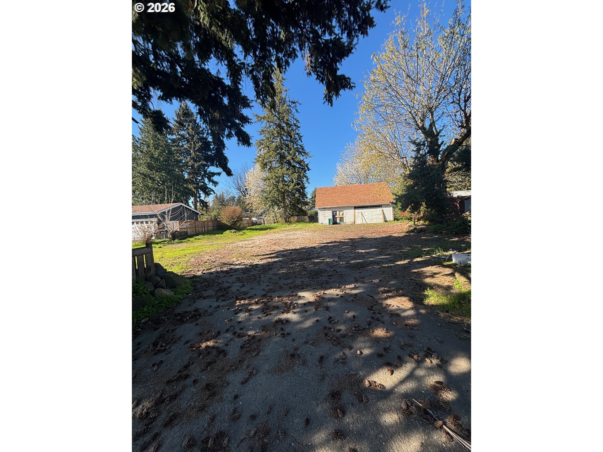 8615 Southeast Roots Road Clackamas, OR 97015 - Photo 2 of 5 a view of a yard with plants and trees