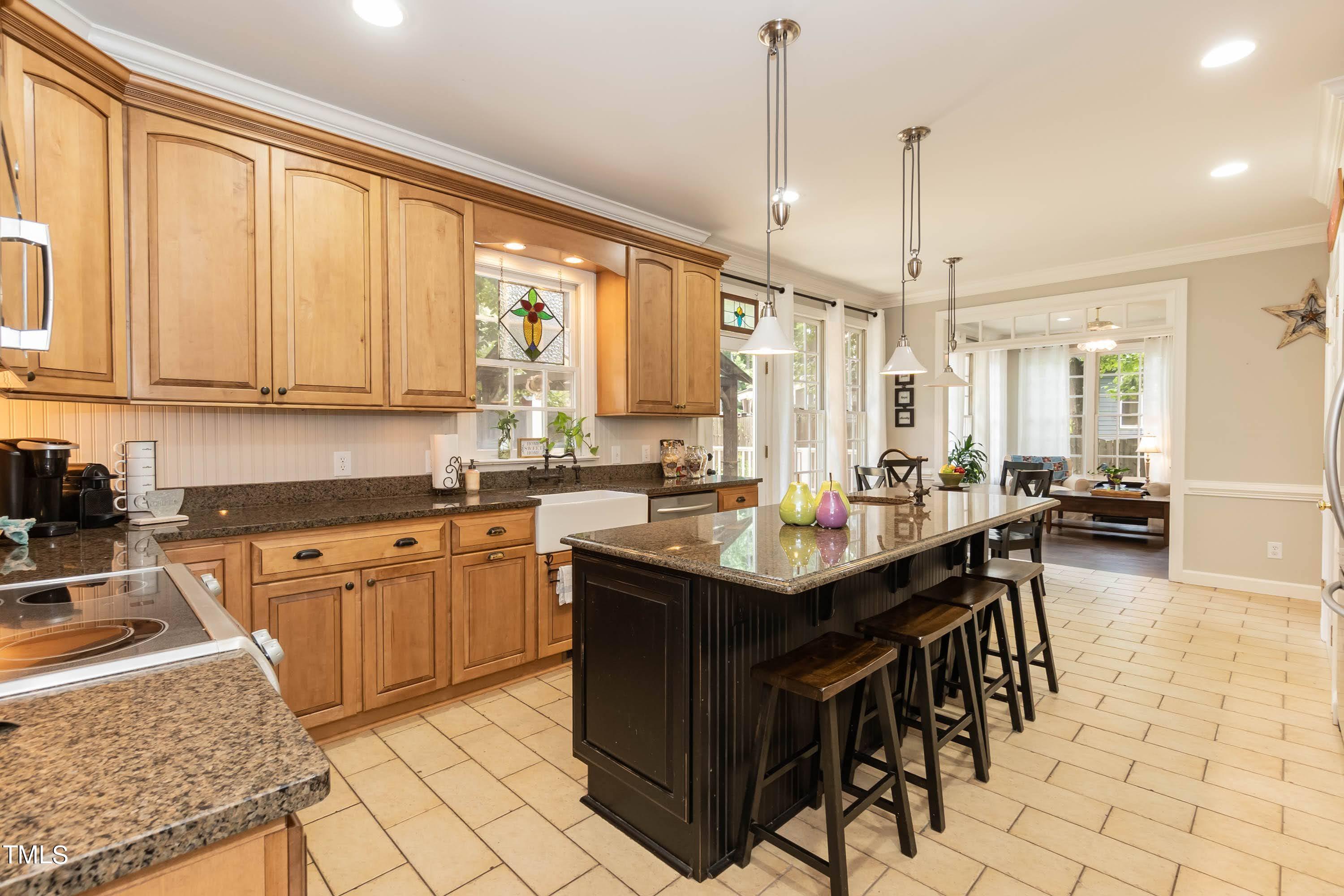 4112 Ridgebrook Bluffs Drive Raleigh, NC 27603 - Photo 19 of 40 Gourmet kitchen withe large working island with copper veggie sink